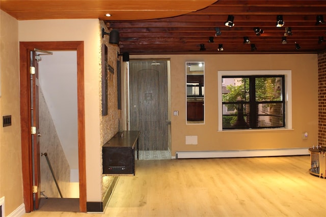 1234East37thStreet E, Brooklyn, NY 11210 - entryway with wood finished floors and a baseboard radiator