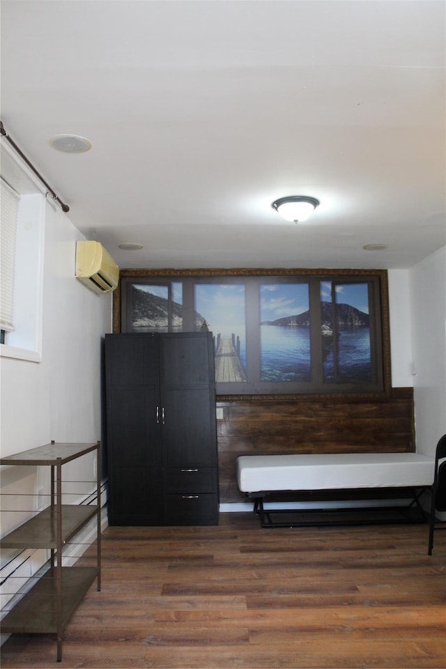 1234East37thStreet E, Brooklyn, NY 11210 - living area featuring an AC wall unit and wood finished floors