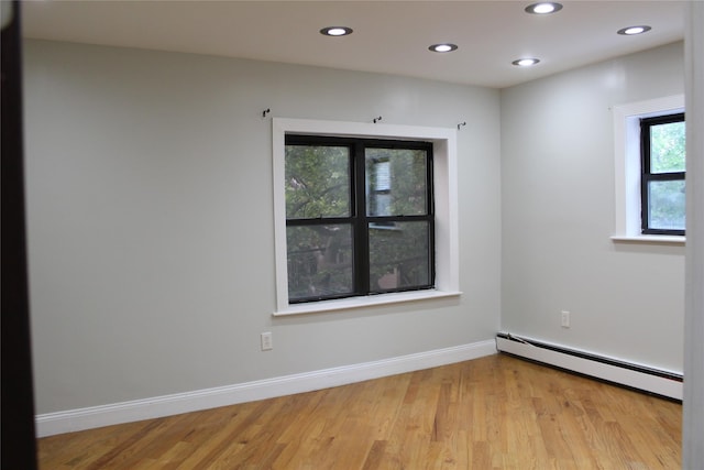 1234East37thStreet E, Brooklyn, NY 11210 - unfurnished room with a baseboard radiator, light wood-style floors, recessed lighting, and baseboards