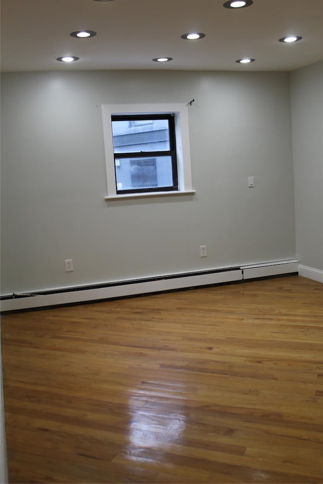 1234East37thStreet E, Brooklyn, NY 11210 - empty room featuring baseboard heating, wood finished floors, recessed lighting, and baseboards