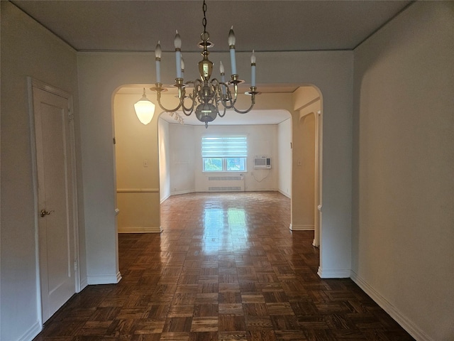 1361 Broadway Unit B26, Hewlett, NY 11557 - unfurnished dining area featuring arched walkways, baseboards, and a chandelier