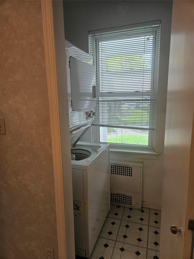 1361 Broadway Unit B26, Hewlett, NY 11557 - laundry room with radiator and washer / dryer