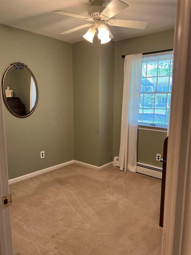 662 Gillette Ave, Bayport, NY 11705 - unfurnished room featuring a baseboard radiator, light carpet, a ceiling fan, baseboards, and a baseboard heating unit
