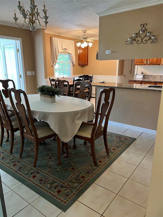 662 Gillette Ave, Bayport, NY 11705 - dining room with crown molding, a chandelier, and light tile patterned floors