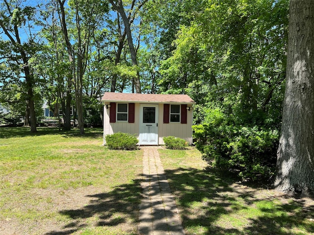 662 Gillette Ave, Bayport, NY 11705 - view of front of property featuring a front yard and an outbuilding