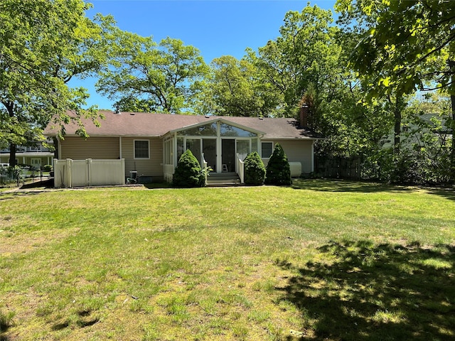 662 Gillette Ave, Bayport, NY 11705 - rear view of house with a chimney and entry steps