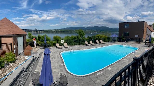 350 N Water St Unit 1-7, Newburgh, NY 12550 - community pool featuring a patio area and a water and mountain view