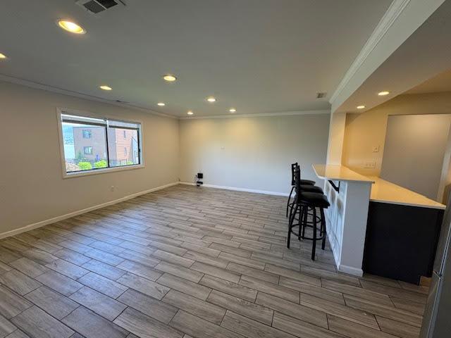 350 N Water St Unit 1-7, Newburgh, NY 12550 - bar area featuring crown molding, wood finished floors, baseboards, and recessed lighting