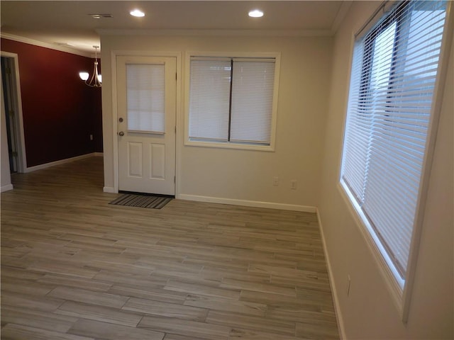 350 N Water St Unit 1-7, Newburgh, NY 12550 - empty room featuring ornamental molding, baseboards, a chandelier, recessed lighting, and wood finished floors