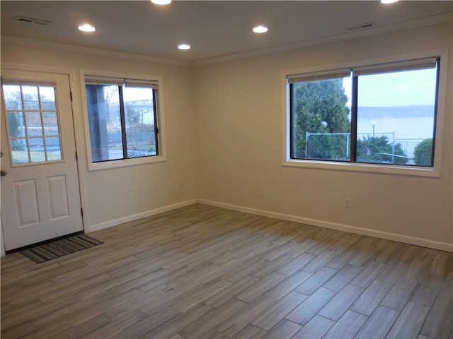 350 N Water St Unit 1-7, Newburgh, NY 12550 - spare room with baseboards, wood finished floors, recessed lighting, and crown molding