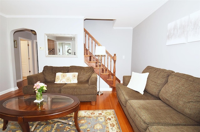 145 Gerard Ave, New Hyde Park, NY 11040 - living room featuring wood finished floors, arched walkways, crown molding, and stairs