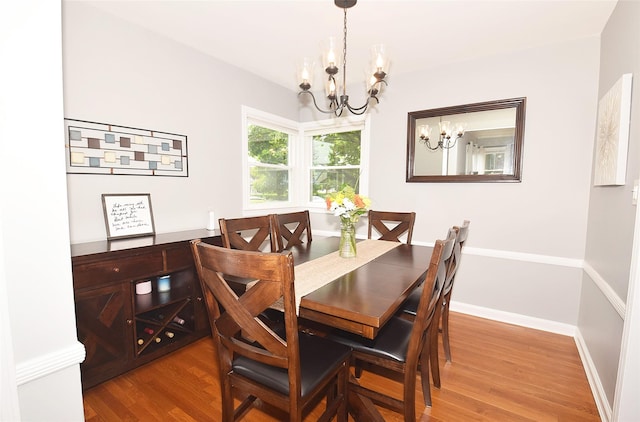 145 Gerard Ave, New Hyde Park, NY 11040 - dining room with a chandelier and wood finished floors