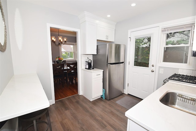145 Gerard Ave, New Hyde Park, NY 11040 - kitchen featuring freestanding refrigerator, a chandelier, dark wood-style floors, light countertops, and recessed lighting