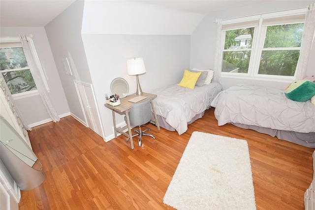 145 Gerard Ave, New Hyde Park, NY 11040 - bedroom featuring lofted ceiling and light wood-style flooring