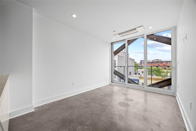 20 Melrose St Unit 4F, Brooklyn, NY 11206 - spare room with finished concrete flooring, baseboards, and recessed lighting