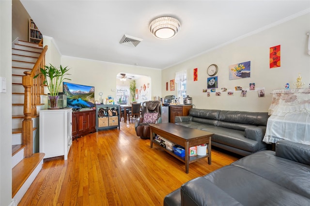 20-29 150th St, Whitestone, NY 11357 - living room with stairway, crown molding, light wood-type flooring, and a ceiling fan