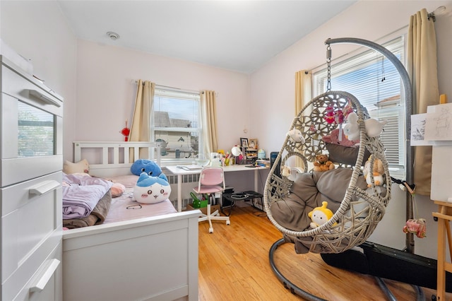 20-29 150th St, Whitestone, NY 11357 - bedroom with multiple windows and light wood-style floors