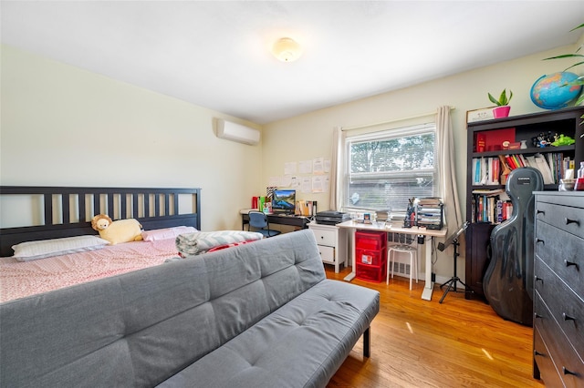 20-29 150th St, Whitestone, NY 11357 - bedroom featuring a wall unit AC and light wood-type flooring