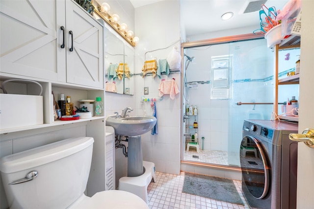 20-29 150th St, Whitestone, NY 11357 - full bathroom featuring washer / dryer, toilet, a stall shower, tile patterned floors, and tile walls