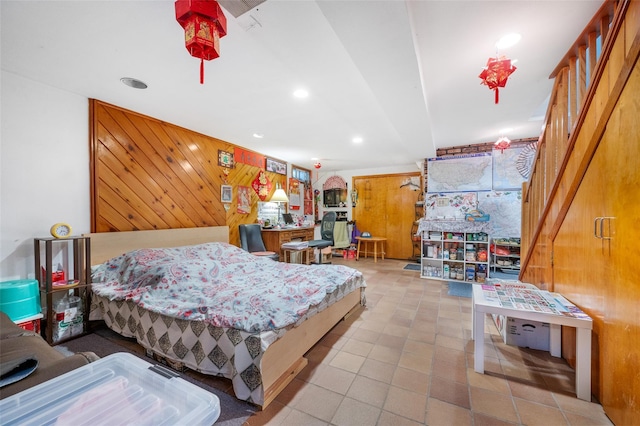 20-29 150th St, Whitestone, NY 11357 - bedroom featuring recessed lighting, wood walls, and tile patterned floors