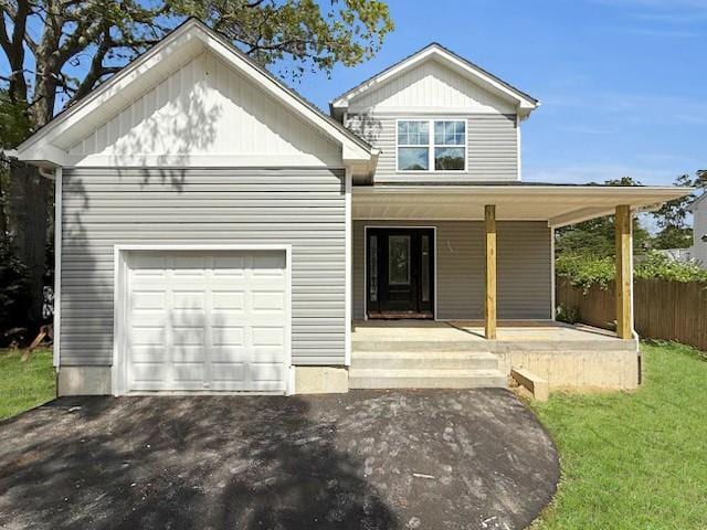 114 W End Dr, Shirley, NY 11967 - view of front facade with covered porch and an attached garage