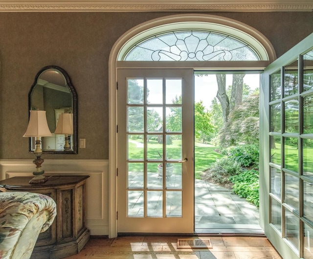 189 Freedom Rd, Pleasant Valley, NY 12569 - entryway with a wainscoted wall and light wood-style floors