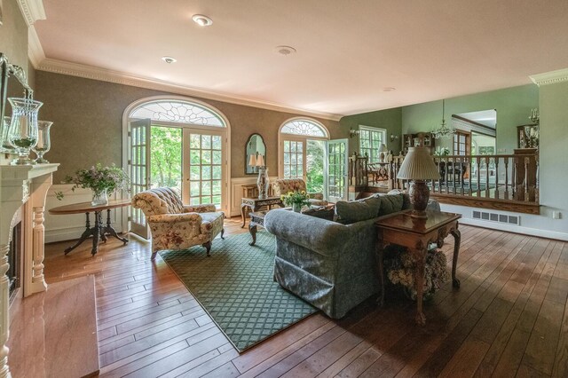 189 Freedom Rd, Pleasant Valley, NY 12569 - living room with hardwood / wood-style floors, ornamental molding, and a fireplace