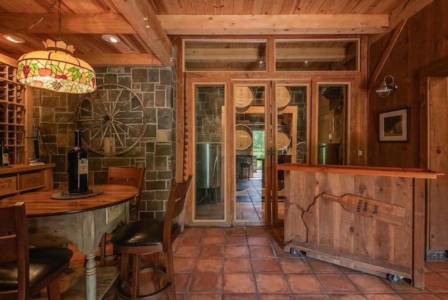 189 Freedom Rd, Pleasant Valley, NY 12569 - bar featuring wood ceiling with exposed beams, tile patterned flooring, and wooden walls