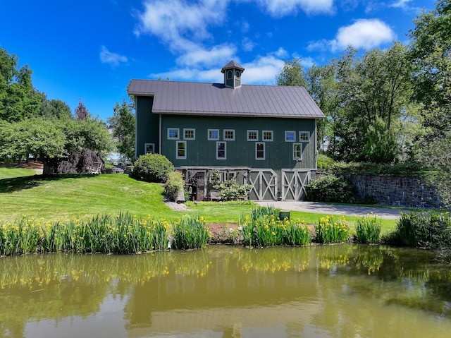 189 Freedom Rd, Pleasant Valley, NY 12569 - rear view of property with a yard, a water view, and metal roof