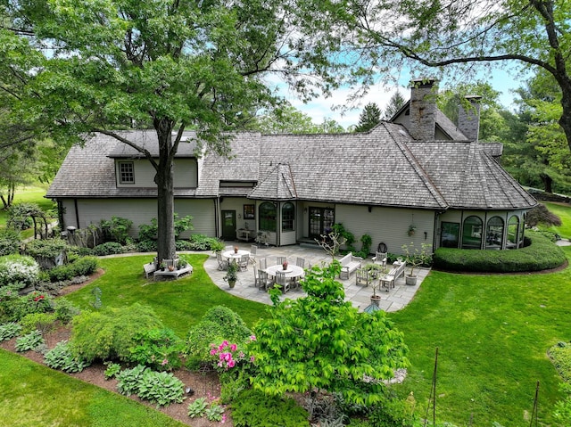 189 Freedom Rd, Pleasant Valley, NY 12569 - rear view of house with a yard, a chimney, and a patio area
