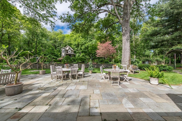 189 Freedom Rd, Pleasant Valley, NY 12569 - view of patio / terrace with outdoor dining area and view of wooded area