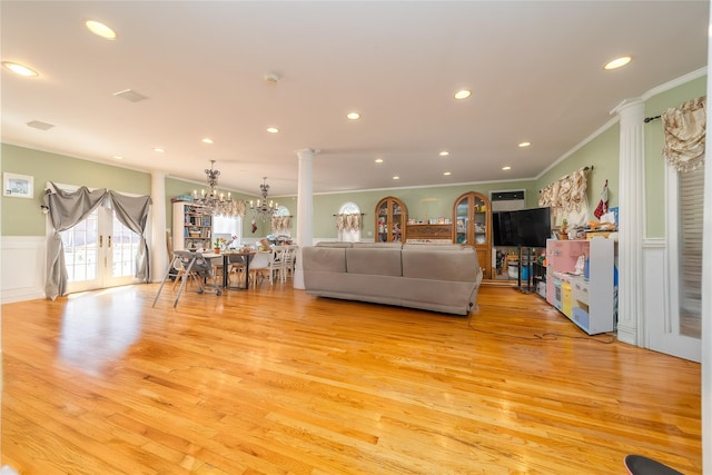 3225 155th St, Flushing, NY 11354 - living room with ornate columns, ornamental molding, light wood-style floors, french doors, and recessed lighting