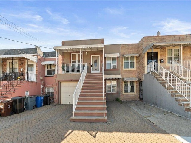 429 Revere Ave, Bronx, NY 10465 - view of property featuring stairway and an attached garage