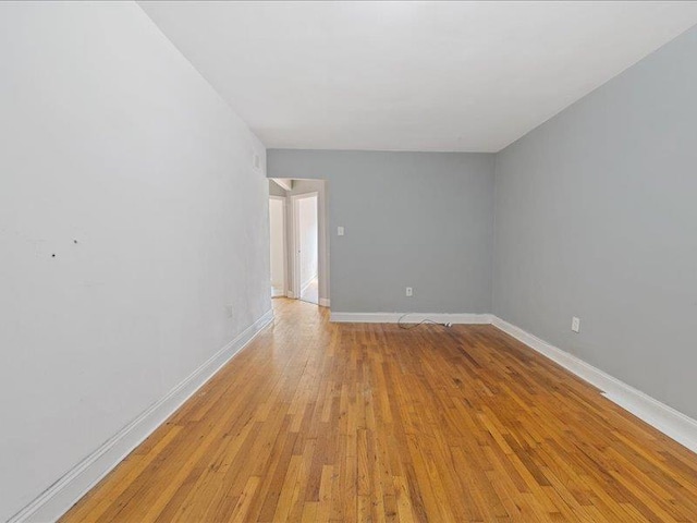 429 Revere Ave, Bronx, NY 10465 - spare room with light wood-style flooring and baseboards