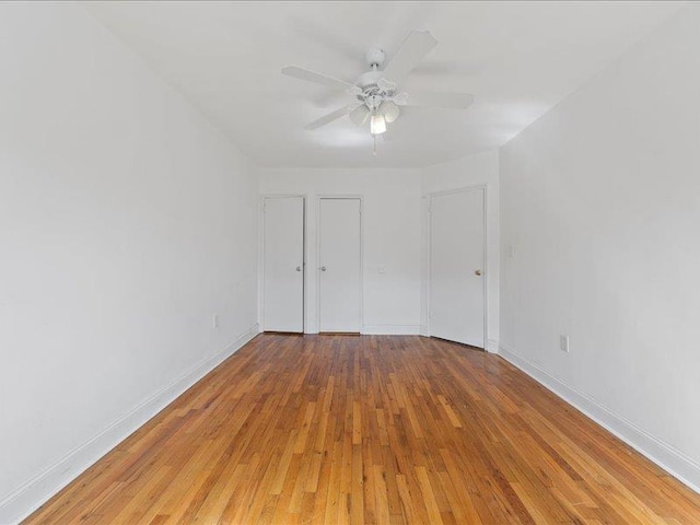 429 Revere Ave, Bronx, NY 10465 - unfurnished bedroom with light wood-style flooring, baseboards, and a ceiling fan
