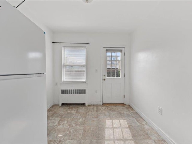 429 Revere Ave, Bronx, NY 10465 - doorway with radiator heating unit and baseboards