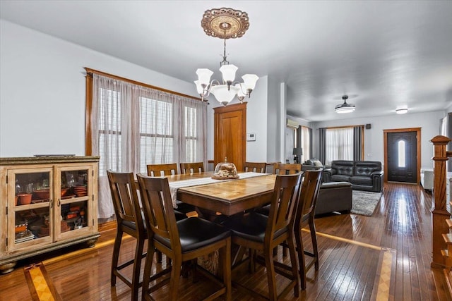 1444 Gillespie Ave, Bronx, NY 10461 - dining space featuring a chandelier and dark wood-style flooring