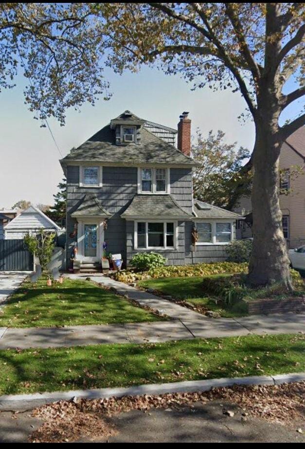 48-13 216th St, Bayside, NY 11364 - traditional style home featuring a chimney