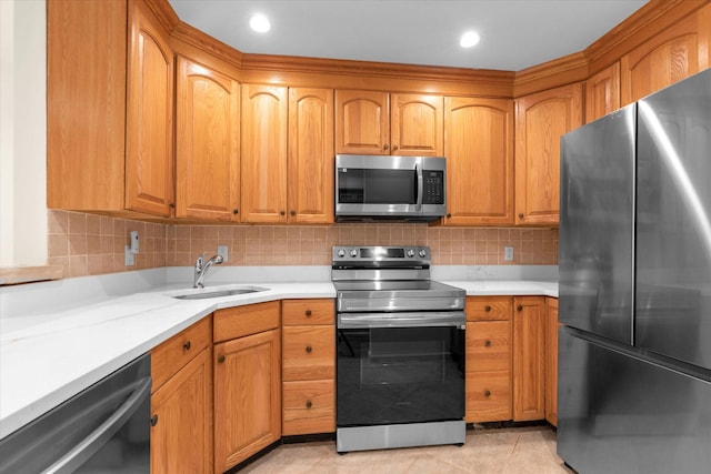 51 W Broadway Unit A, Long Beach, NY 11561 - kitchen with appliances with stainless steel finishes, a sink, light countertops, backsplash, and light tile patterned flooring