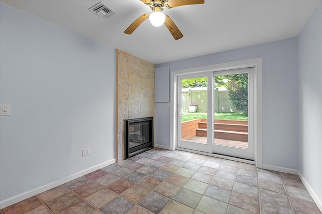 51 W Broadway Unit A, Long Beach, NY 11561 - unfurnished living room with baseboards, a fireplace, light stone finish floors, and a ceiling fan