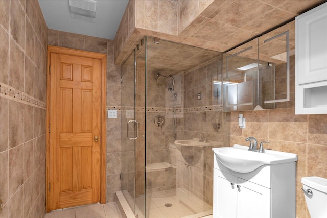 51 W Broadway Unit A, Long Beach, NY 11561 - full bath featuring tile walls, a shower stall, vanity, and toilet
