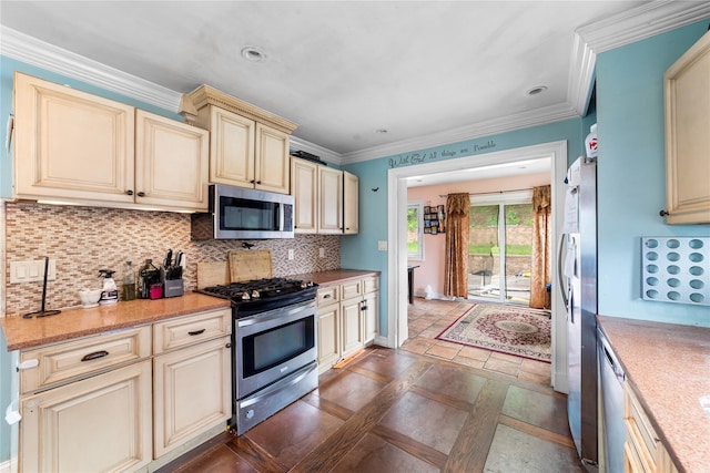 773 Mile Square Rd, Yonkers, NY 10704 - kitchen featuring cream cabinetry, stainless steel appliances, tasteful backsplash, crown molding, and stone tile floors