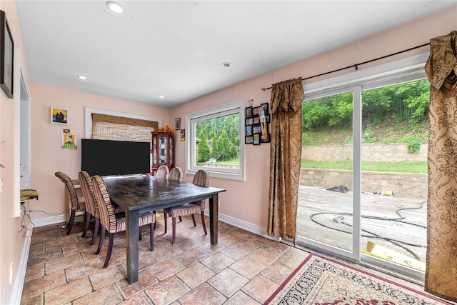 773 Mile Square Rd, Yonkers, NY 10704 - dining room featuring baseboards, stone tile floors, and recessed lighting