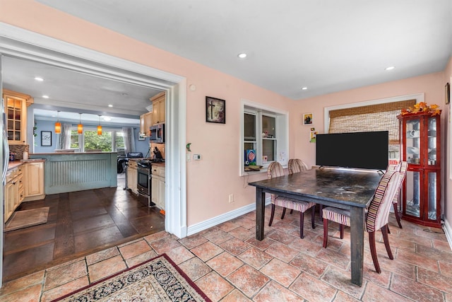 773 Mile Square Rd, Yonkers, NY 10704 - dining area with baseboards, stone tile floors, and recessed lighting