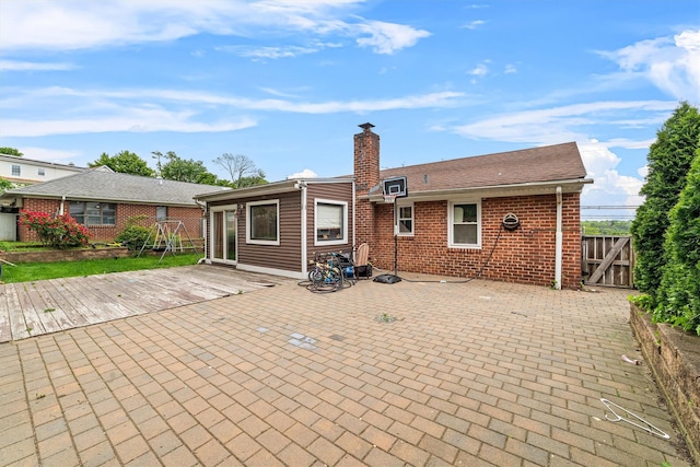 773 Mile Square Rd, Yonkers, NY 10704 - back of house featuring a chimney, brick siding, a patio, and a gate