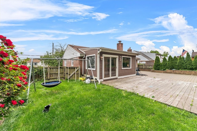 773 Mile Square Rd, Yonkers, NY 10704 - rear view of house with a wooden deck and a chimney