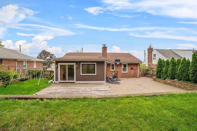 773 Mile Square Rd, Yonkers, NY 10704 - rear view of house featuring a patio area, a chimney, and brick siding