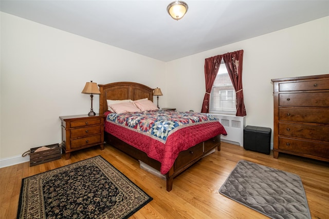 60 Locust Unit A-609, New Rochelle, NY 10801 - bedroom with radiator heating unit, wood finished floors, and baseboards