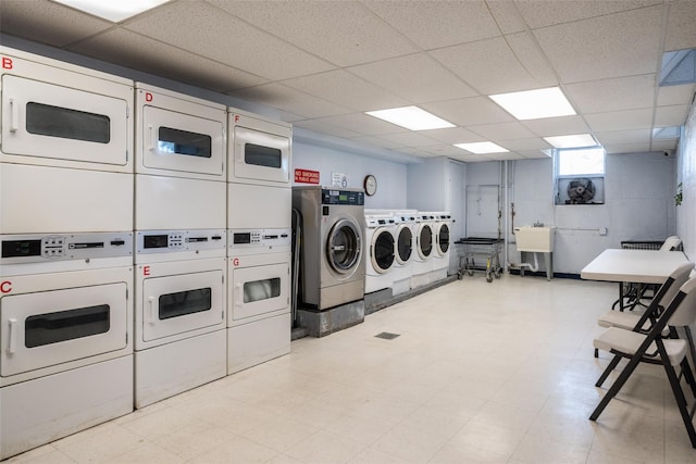 60 Locust Unit A-609, New Rochelle, NY 10801 - shared laundry with stacked washing machine and dryer, washing machine and clothes dryer, and light floors