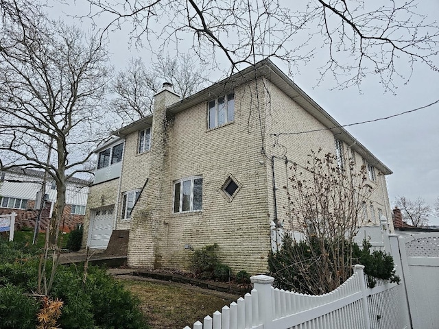 154-70 11th Ave, Whitestone, NY 11357 - view of property exterior featuring a chimney and brick siding